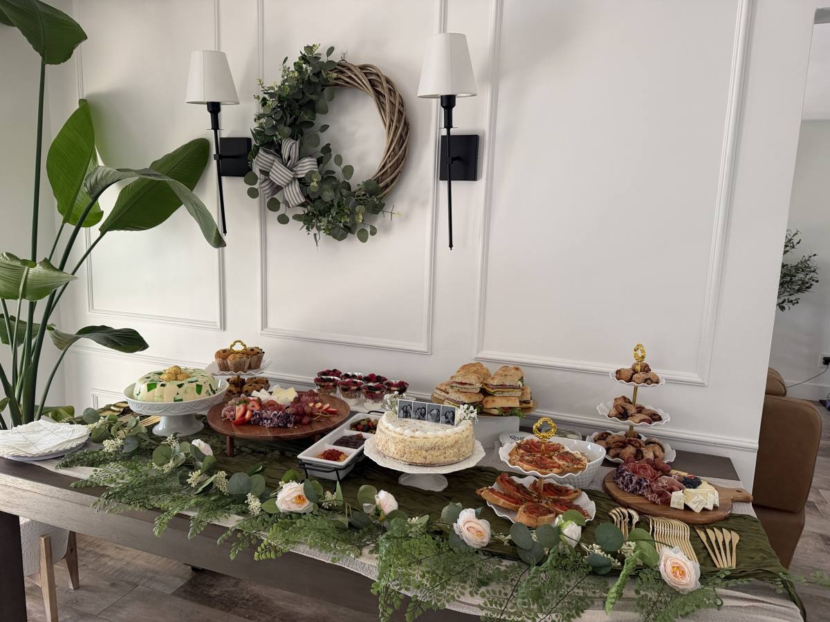 Appetizers, dips and desserts on a green table runner